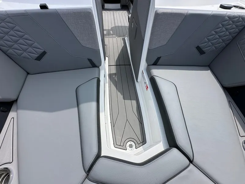Slide: The Image of Interior of 2026 Nautique Super Air Nautique GS22 with gray upholstery. - 22