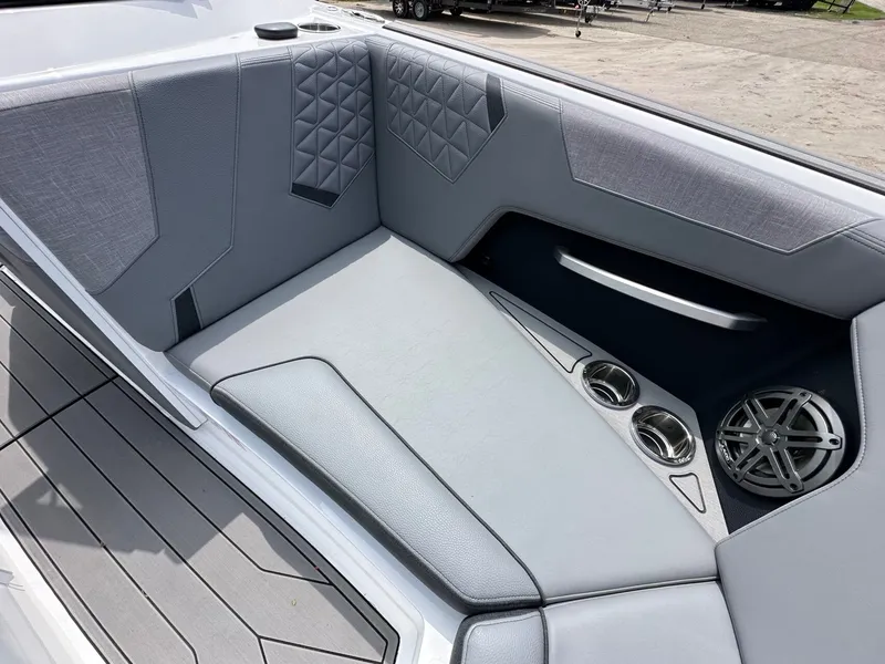 Slide: The Image of Interior of 2026 Nautique Super Air Nautique GS22 with gray upholstery. - 23