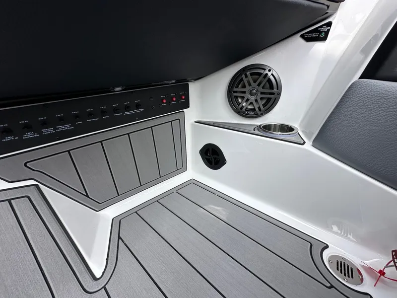 Slide: The Image of Interior of 2026 Nautique Super Air Nautique GS22 with speaker and controls. - 25