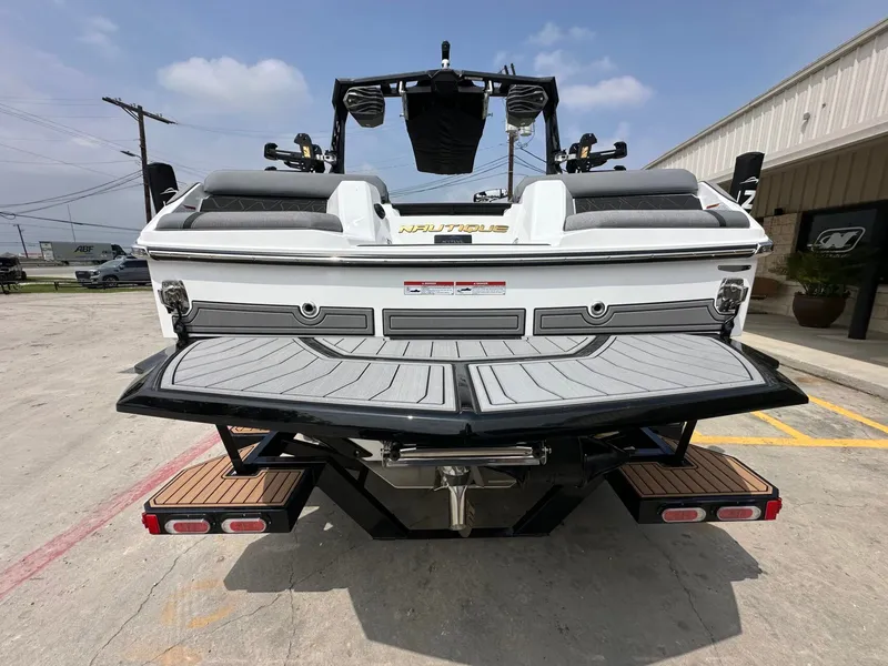 Slide: The Image of Rear view of 2026 Nautique Super Air Nautique GS22 boat. - 4
