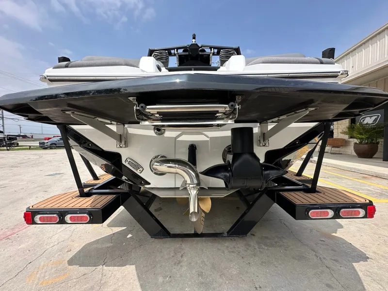 Slide: The Image of Rear view of 2026 Nautique Super Air Nautique GS22 boat. - 5