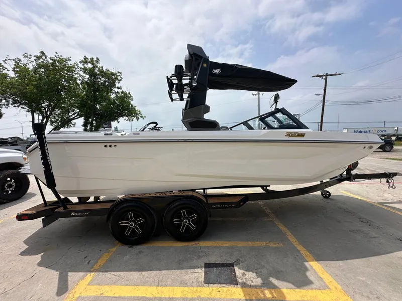 Slide: The Image of 2026 Nautique Super Air Nautique GS22 on trailer, side view. - 7