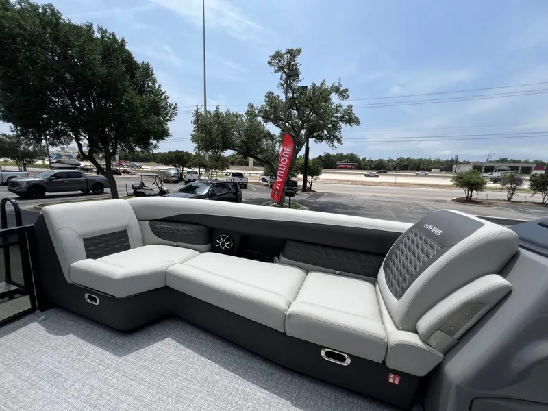 Slide: The Image of 2026 Harris Sunliner 250 pontoon boat with luxurious outdoor seating. - 15