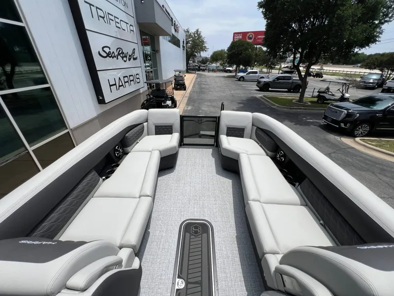 Slide: The Image of Interior of Harris Sunliner 250 pontoon boat, 2026 model, featuring luxurious seating. - 16