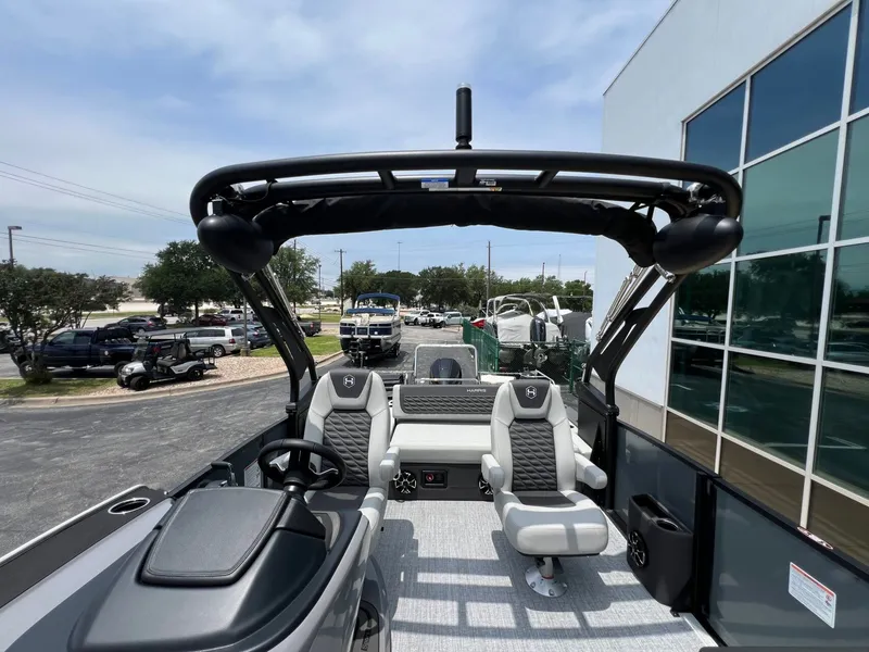 Slide: The Image of Interior view of the 2026 Harris Sunliner 250 pontoon boat. - 17