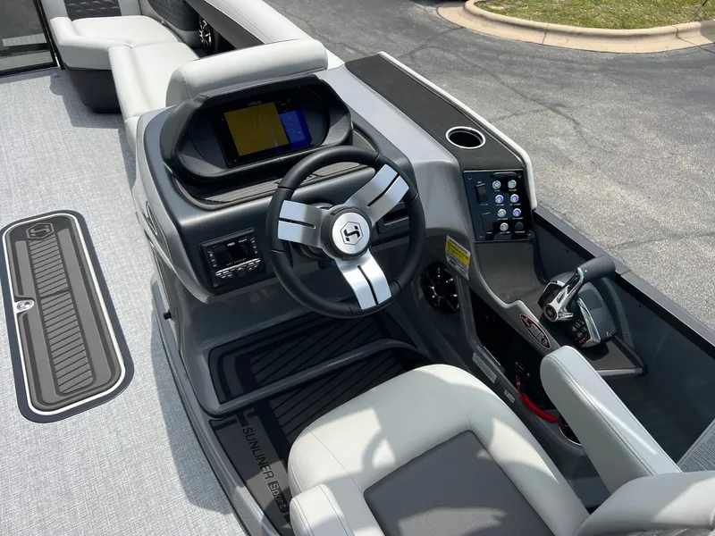 Slide: The Image of Interior of Harris Sunliner 250 boat, 2026 model, featuring modern helm. - 20