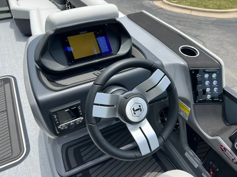 Slide: The Image of Steering console of Harris Sunliner 250 boat, model year 2026. - 21