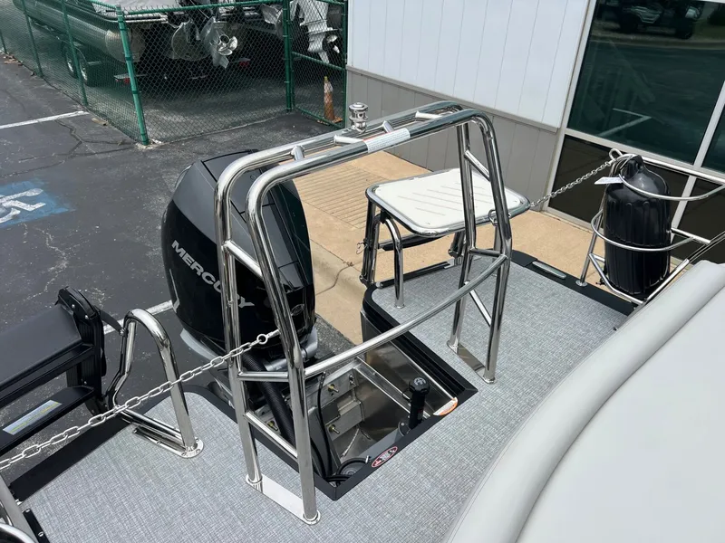 Slide: The Image of Harris Sunliner 250 2026 with Mercury engine and stainless steel railing. - 27