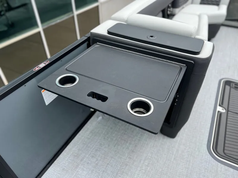 Slide: The Image of Harris Sunliner 250 2026 with fold-out table and cup holders. - 29