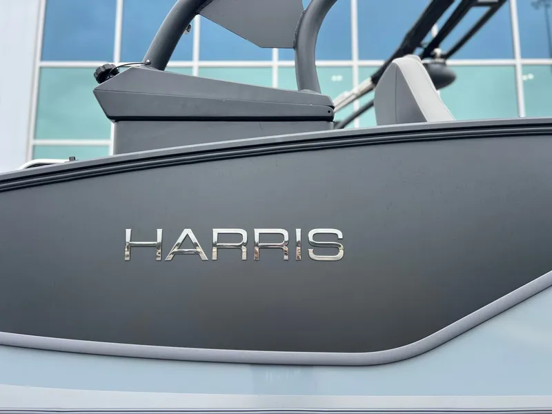 Slide: The Image of Harris Sunliner 250 boat 2026, close-up of logo. - 35