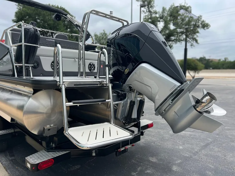 Slide: The Image of 2026 Harris Sunliner 250 with powerful outboard motor. - 6