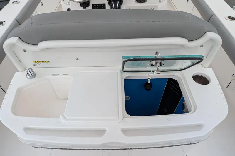 Slide: The Image of 2023 Everglades 273 Center Console boat interior with open storage compartment. - 7