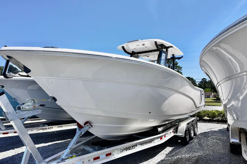 The Image of 2026 Sea Fox 328 Commander boat on trailer under clear blue sky. - 0