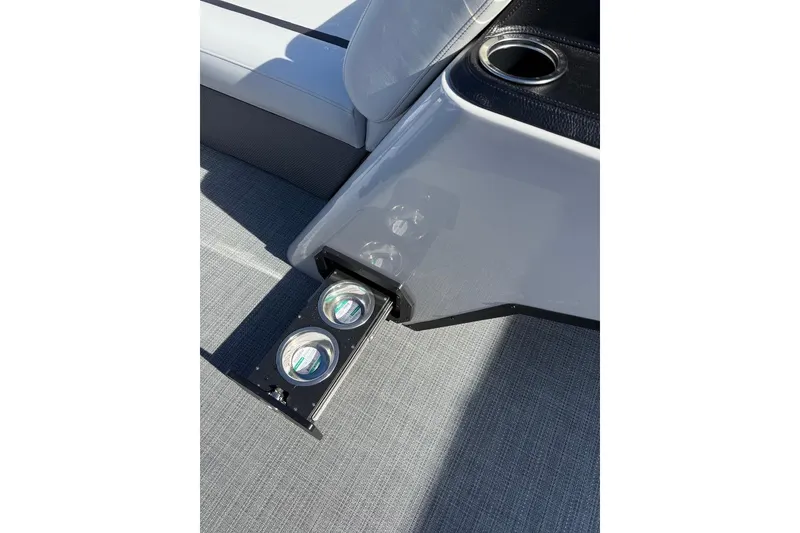 Slide: The Image of 2025 Crest CLASSIC 220 SLC boat interior with retractable cup holders and seating. - 10