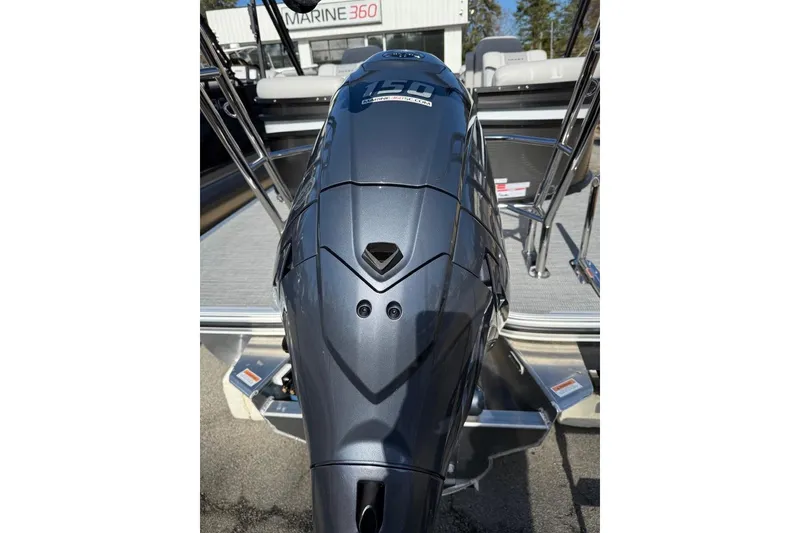Slide: The Image of 2025 Crest CLASSIC 220 SLC boat with powerful outboard motor, parked outdoors. - 4