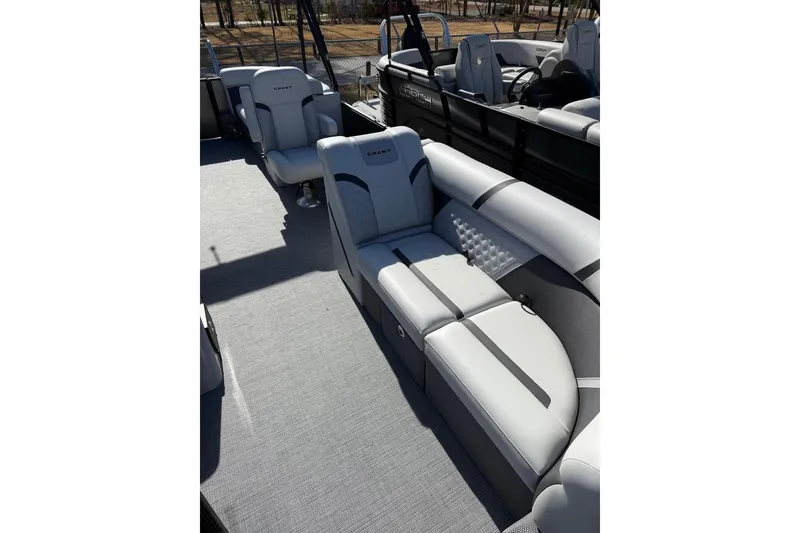 Slide: The Image of 2025 Crest CLASSIC 220 SLC boat interior with luxurious seating and modern design. - 6