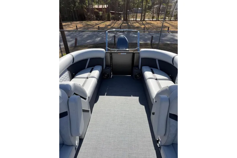 Slide: The Image of 2025 Crest CLASSIC 220 SLC pontoon boat interior with plush seating and spacious layout. - 8