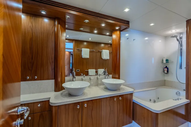 Slide: The Image of Luxurious bathroom on 2004 Sunseeker 105 Yacht with dual sinks and jacuzzi tub. - 72