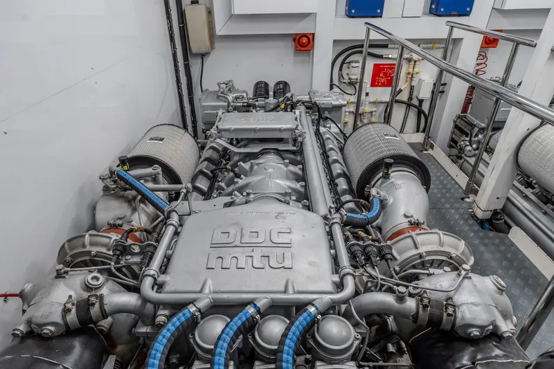 Slide: The Image of Engine room of a 2004 Sunseeker 105 Yacht, featuring a powerful DDC MTU engine. - 89