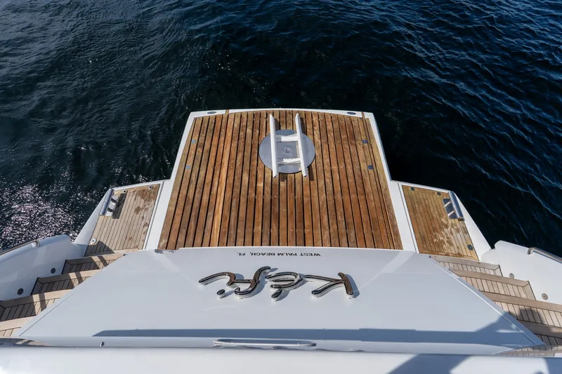 Slide: The Image of Sunseeker 105 Yacht 2004, wooden deck, ocean view, luxury boating experience. - 41