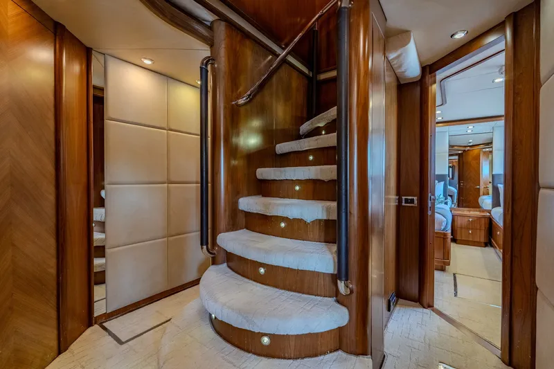 Slide: The Image of Luxurious interior of 2004 Sunseeker 105 Yacht featuring elegant wooden staircase and plush carpeting. - 63