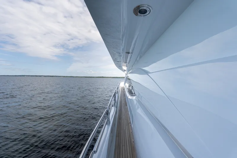 Slide: The Image of Side view of a 2004 Sunseeker 105 Yacht cruising on open water. - 40