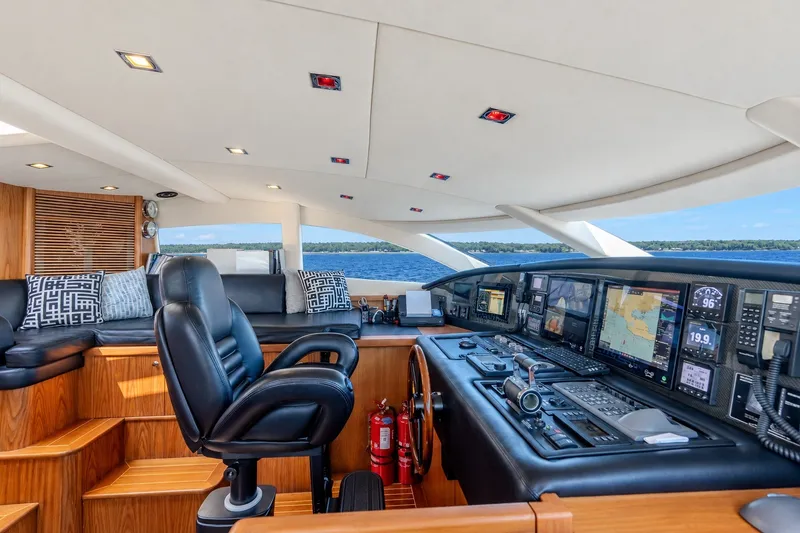 Slide: The Image of Luxurious 2004 Sunseeker 105 Yacht cockpit with advanced navigation systems and plush seating. - 29