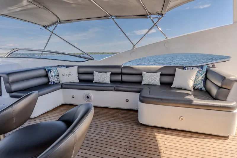 Slide: The Image of Luxurious Sunseeker 105 Yacht 2004 deck with elegant seating and ocean view. - 25