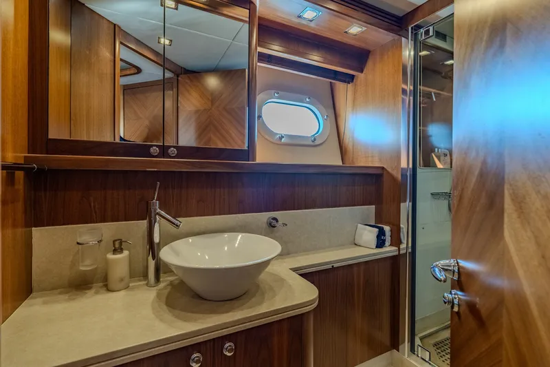 Slide: The Image of Luxurious bathroom interior on 2004 Sunseeker 105 Yacht with modern fixtures and wood accents. - 75