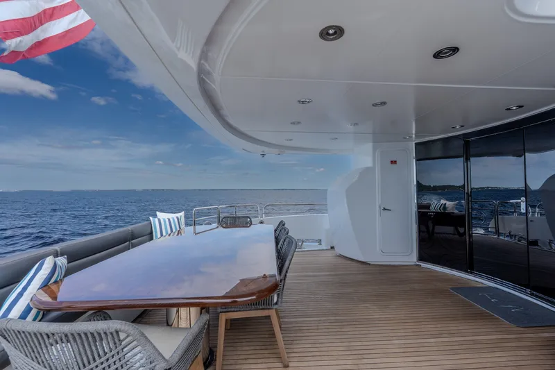 Slide: The Image of Luxurious 2004 Sunseeker 105 Yacht deck with ocean view and elegant seating. - 34