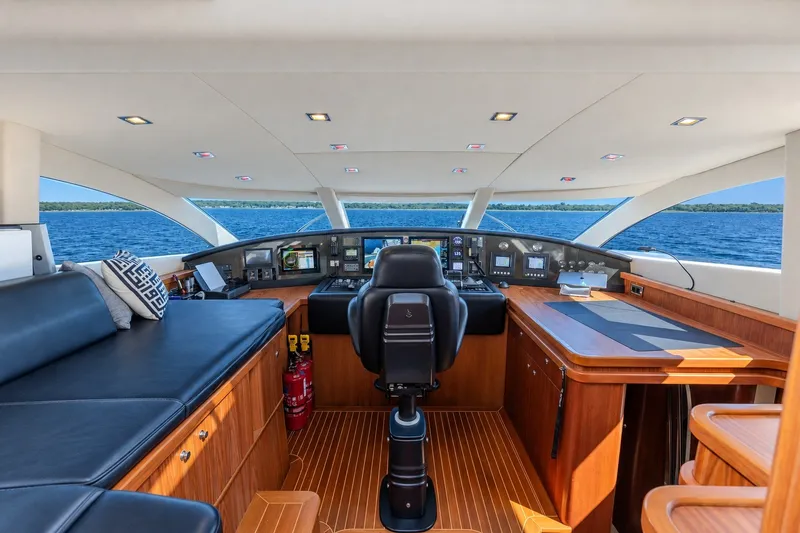 Slide: The Image of Luxurious 2004 Sunseeker 105 Yacht helm with modern controls and panoramic ocean view. - 27