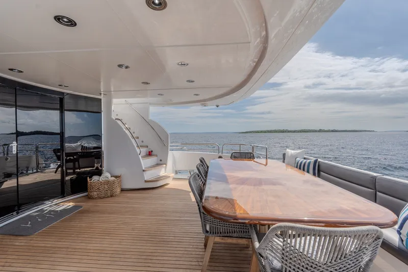 Slide: The Image of Luxurious Sunseeker 105 Yacht deck with elegant seating and ocean view, 2004 model. - 33