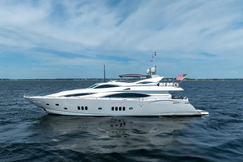 The Image of Luxurious 2004 Sunseeker 105 Yacht cruising on open water under a clear sky. - 1