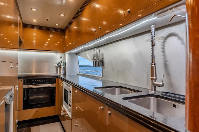 Slide: The Image of Luxurious kitchen interior of 2004 Sunseeker 105 Yacht with modern appliances and sleek design. - 54