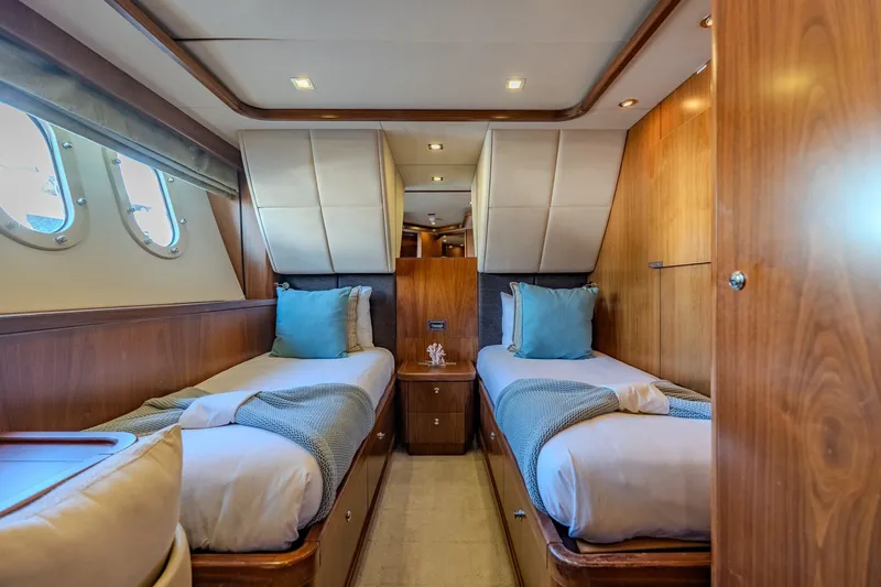 Slide: The Image of Luxurious twin cabin interior of 2004 Sunseeker 105 Yacht with elegant wood finish. - 77