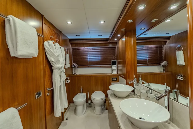 Slide: The Image of Luxurious bathroom on 2004 Sunseeker 105 Yacht with elegant wood paneling and modern fixtures. - 71