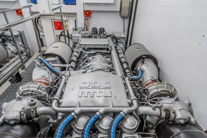 Slide: The Image of Engine room of a 2004 Sunseeker 105 Yacht, featuring a DDC MTU engine. - 88