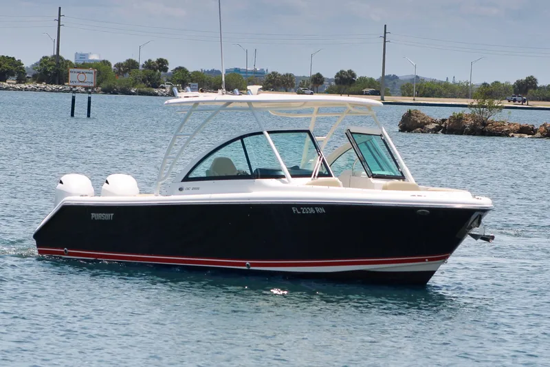 The Image of 2018 Pursuit DC 265 Dual Console boat cruising on a sunny day. - 0