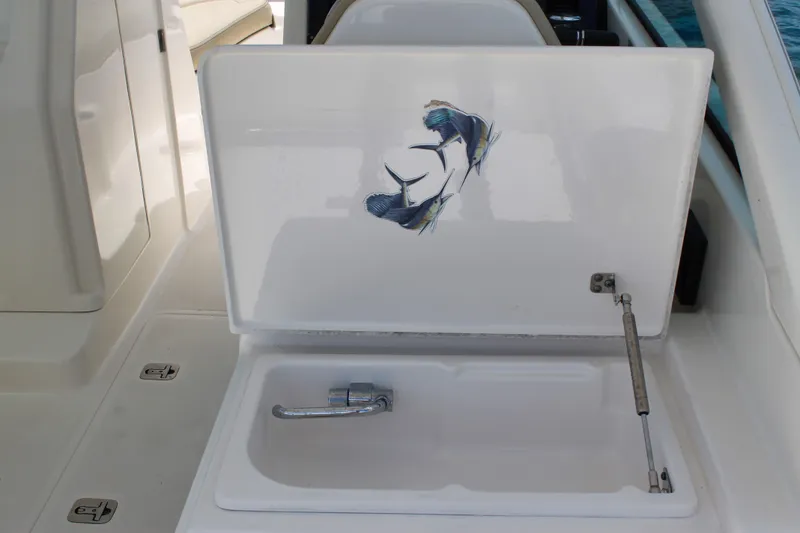 Slide: The Image of 2018 Pursuit DC 265 Dual Console boat sink with marlin artwork on lid. - 30
