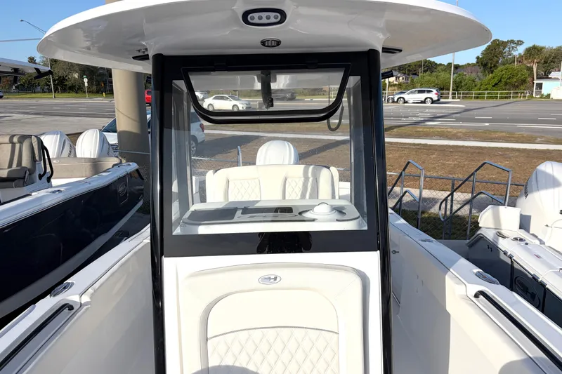 Slide: The Image of 2026 Sea Hunt Ultra 255 SE boat interior with modern helm and seating. - 10