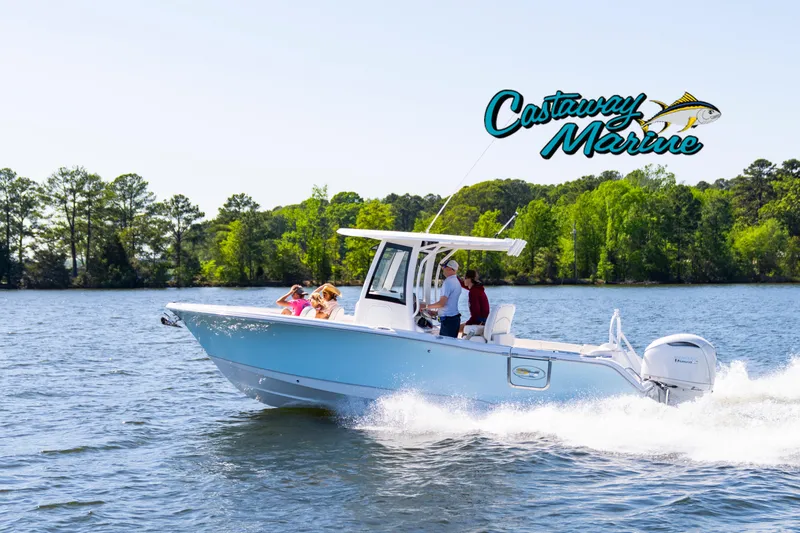 Slide: The Image of 2026 Sea Hunt Ultra 255 SE boat cruising on a lake with passengers, Castaway Marine logo visible. - 32