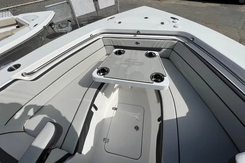 Slide: The Image of 2026 Sea Pro 240 Dual Console boat interior with seating and table. - 10