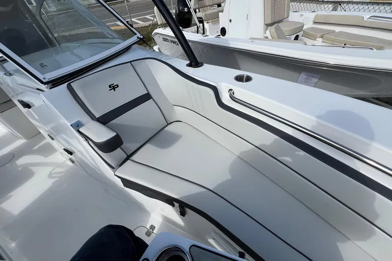 Slide: The Image of 2026 Sea Pro 240 Dual Console boat interior with sleek seating and cup holder. - 22