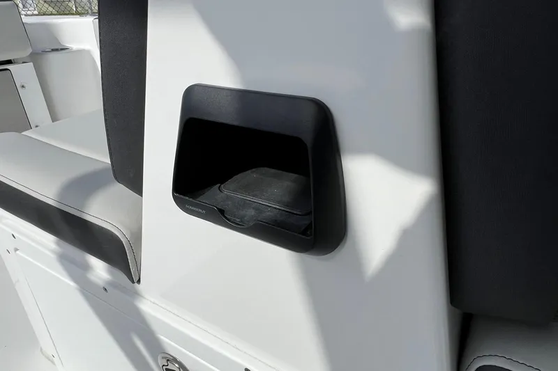 Slide: The Image of 2026 Sea Pro 240 Dual Console interior detail with storage compartment. - 23