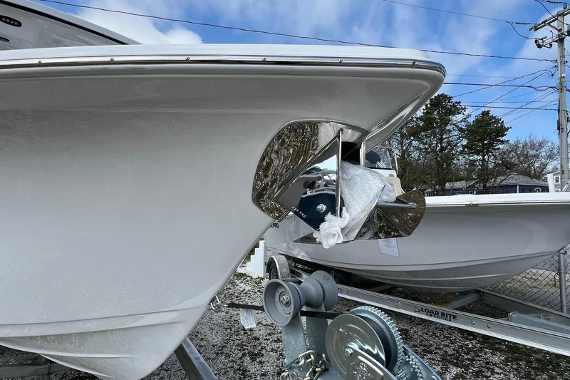 Slide: The Image of 2026 Sea Pro 240 Dual Console boat on trailer, showcasing bow and anchor detail. - 3