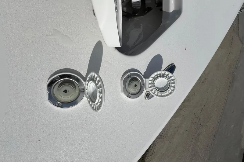 Slide: The Image of Fuel and water fill ports on a 2026 Sea Pro 240 Dual Console boat. - 31