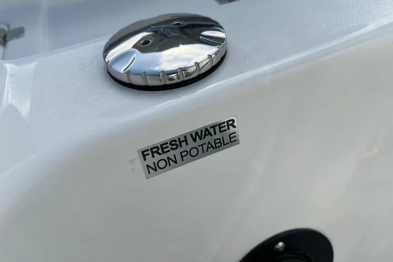 Slide: The Image of Sea Pro 240 Dual Console 2026, fresh water non-potable label on boat surface. - 33