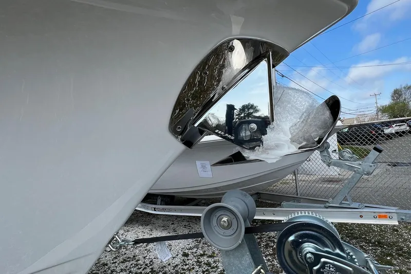 Slide: The Image of 2026 Sea Pro 240 Dual Console boat on trailer, showcasing sleek design and modern features. - 4