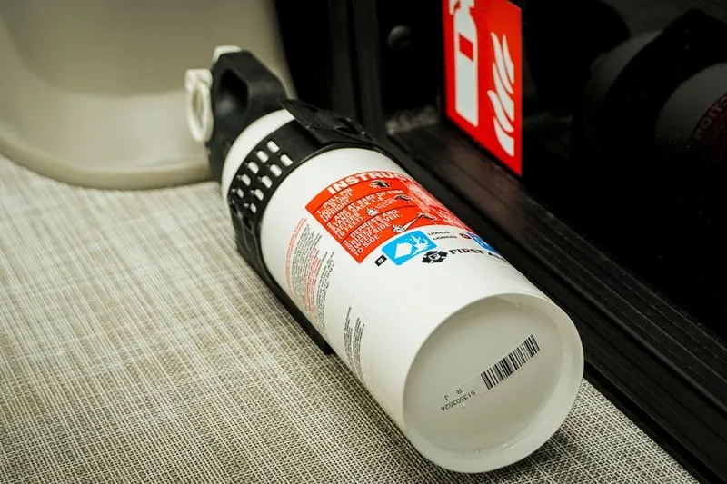 Slide: The Image of Fire extinguisher on Dockside 20DQ 2026 boat, safety equipment, close-up view. - 11