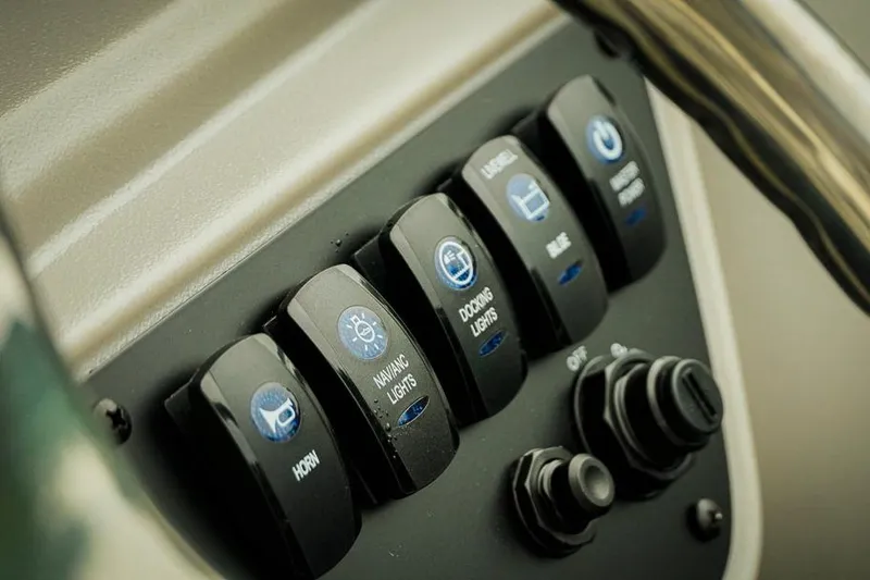 Slide: The Image of Control panel of Dockside 20DQ 2026 boat with labeled switches and buttons. - 21